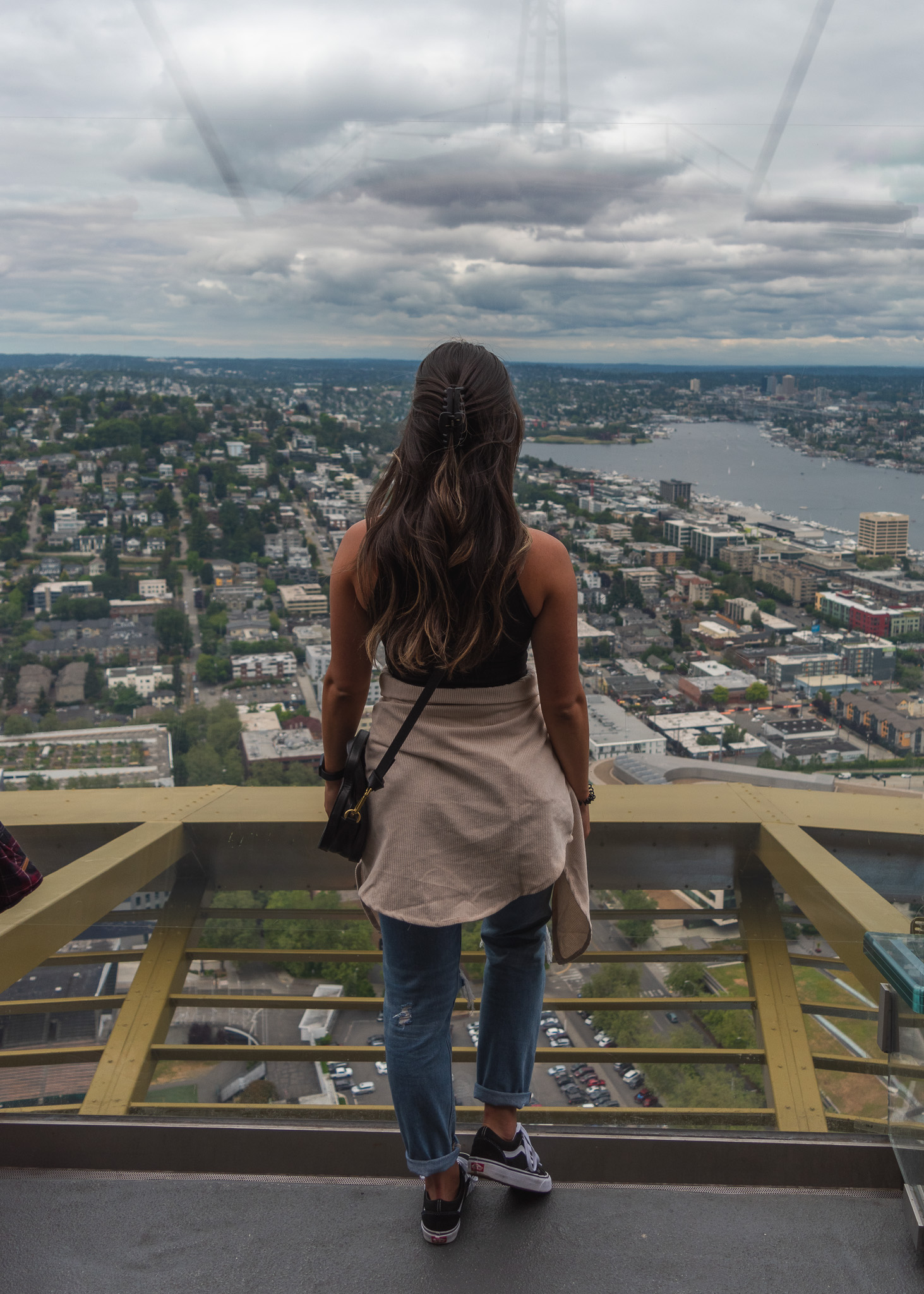 Mia looking out over the city of Seattle on top of the Space Needle