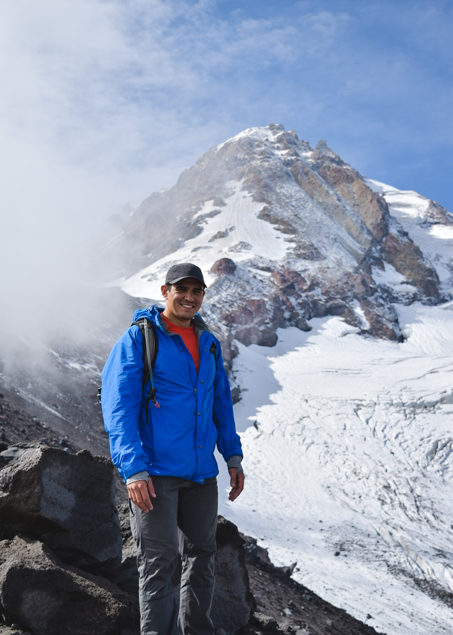 Jay standing next to Elliott Glacier on Mt. Hood on the Cooper Spur hike