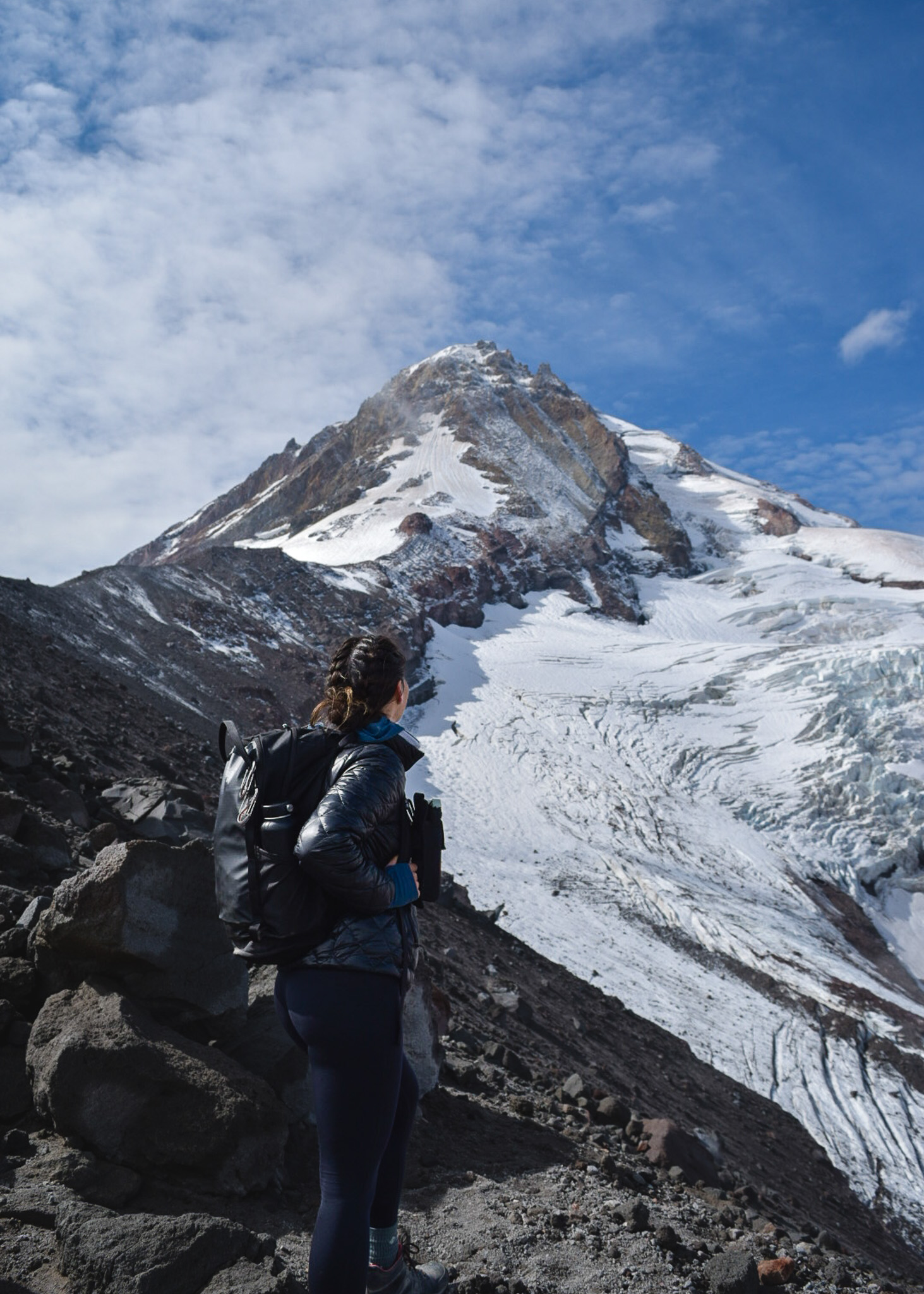 Mia looking out a Elliott Glacier while hiking Cooper Spur on Mt. Hood