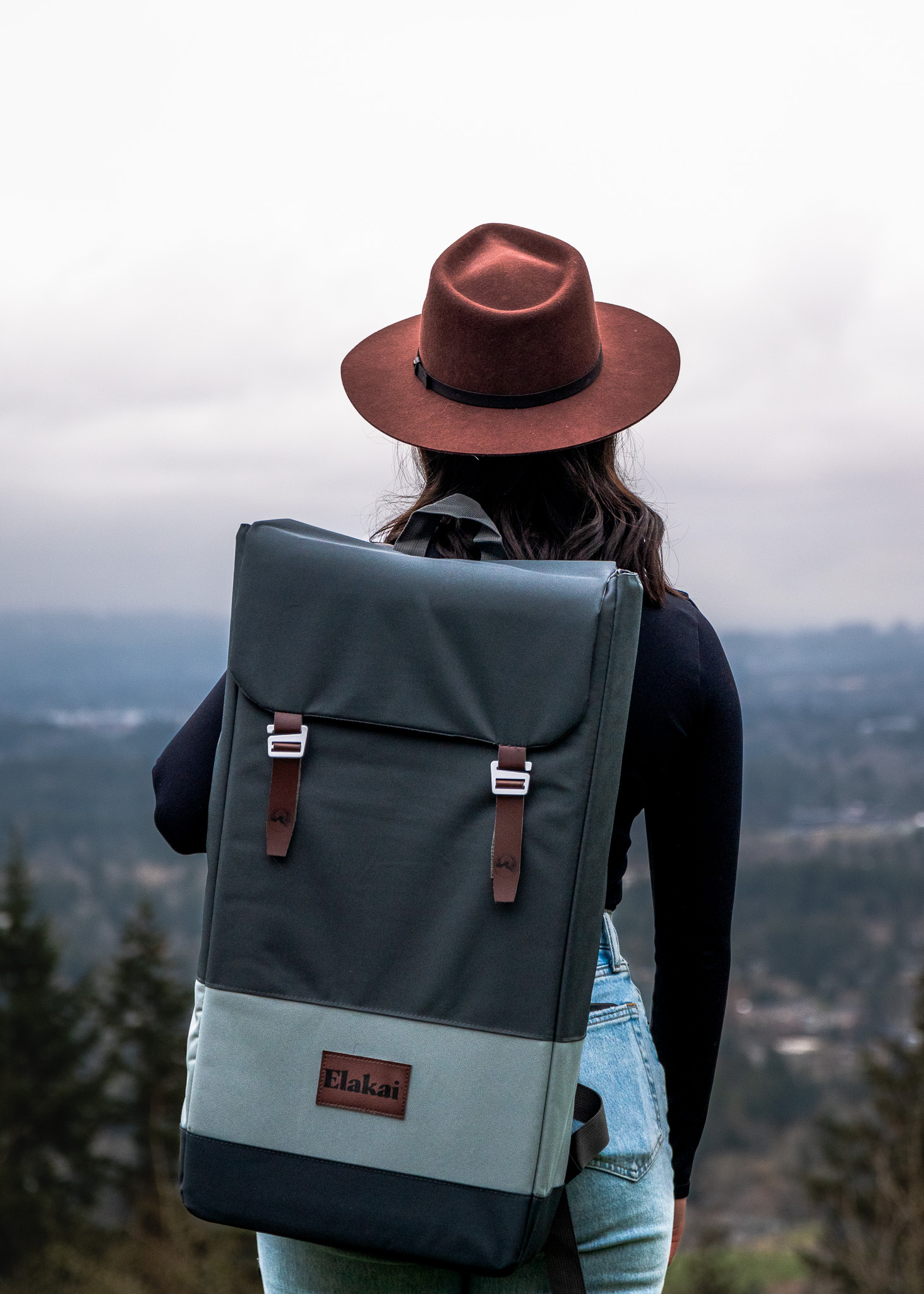 Product photo of Mia wearing the Elakai Outdoor backpack case for cornhole