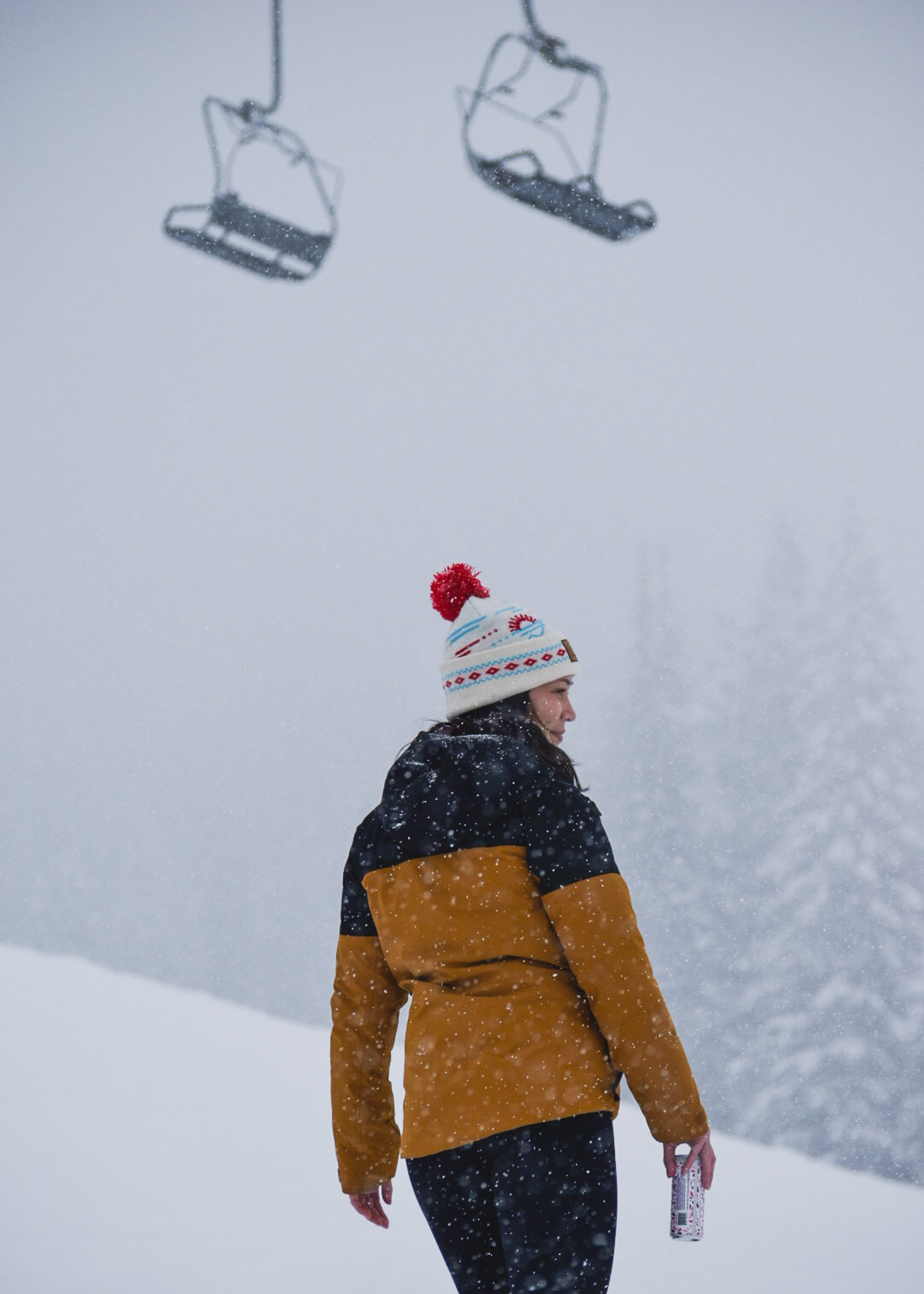 Mia standing near the ski lift in Whitefish Mountain Resort in Montana